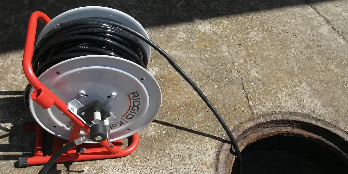 sewer rodding equipment prepared to clear clogged sewer lines in Chicago, IL
